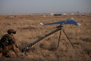 Italian Army 41st Regiment Cordenons operator launching a Bramor C4EYE drone